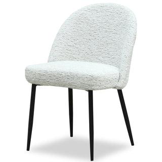 Light grey textured upholstered dining chair with curved back and slender black metal legs.
