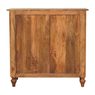 Rear view of the mango wood chest, showing the panelled back and turned feet.