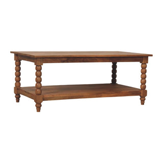 Medium brown wooden coffee table featuring turned spindle legs and a full-width undershelf.