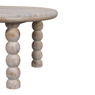 Detail of the round salted oak tabletop edge where it meets the turned bobbin legs.