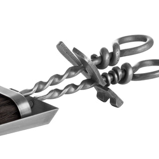 Close view of the twisted steel handles, forged joints, and elegant loop ends of the hearth tidy set.