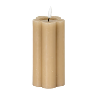 Plain front-on view of a tall, stone-coloured, fluted LED candle with a lit faux flame.