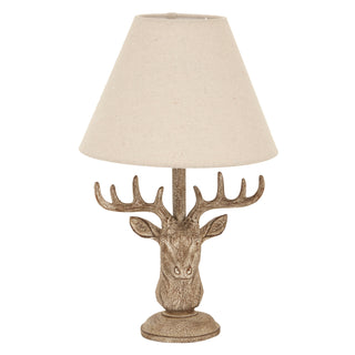 Plain front-on view of the table lamp featuring a textured stag head base and a conical linen shade.
