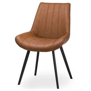 Tan faux leather dining chair with vertical stitched back and black angled legs, shown on a white background.