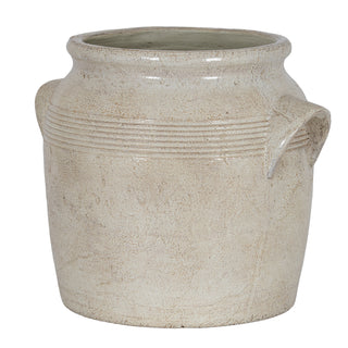 Plain front-on studio shot of a small, rustic, off-white ceramic pot with handles and horizontal bands.