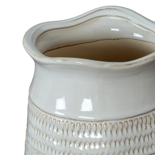 Detail shot of the wavy rim and smooth glazed upper section transitioning to the textured body.
