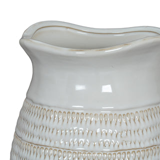 Detail shot showing the wavy rim, smooth glazed neck, and the upper textured band of the white ceramic vase.