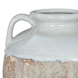 Close-up showing the rough edge where the white crackle glaze meets the textured, rustic grey and brown lower body.