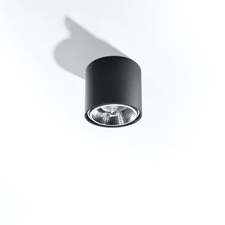 Black cylindrical light fixture viewed from below against a white background, highlighting the shadow cast.