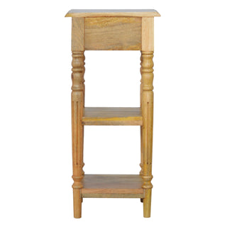 Narrow side profile of the wooden table with turned legs and two connecting shelves.