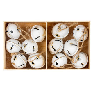Full view of twelve distressed white metal bells with twine loops packed into the divided wooden box.