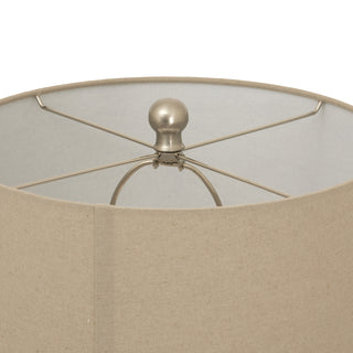 Close-up of the beige linen shade top, showing the silver finial and internal metal support frame.