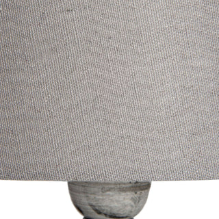 Close-up detail of the coarse woven texture of the natural linen lampshade fabric.
