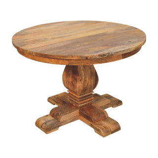 Angled view showing the plank construction of the round wooden tabletop and the heavy turned pedestal base.