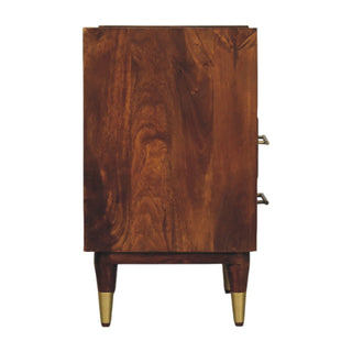 Side profile of the dark mango wood bedside table, showing the deep wood grain and brass handles.