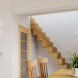Wide shot of a modern interior featuring a wooden block staircase; the wall light is visible on the left wall providing upward illumination.