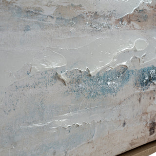 Close detail of the canvas showing thick glossy paint and scattered silver metallic flecks on the blue and beige background.