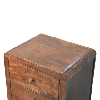 Close-up detail of the dark walnut top surface and smoothly rounded corner of the bedside cabinet.