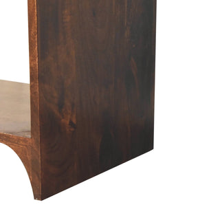 Detail shot of the dark walnut frame, highlighting the wood grain and the curved base cut-out.