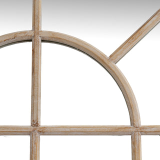 Close detail of the washed wood arch and the vertical and horizontal window frame dividers.