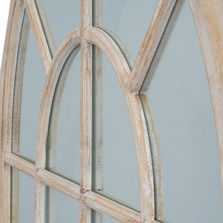 Close detail of the arched wooden frame, showing the joints and the distressed finish.