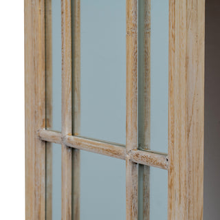Side perspective of the washed wood frame and the central joint of the window grid.