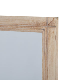 Close detail of the washed wood frame's top right corner joint.