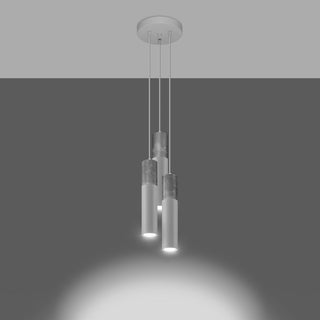 Three pendant lights illuminated, casting bright circular beams downwards.