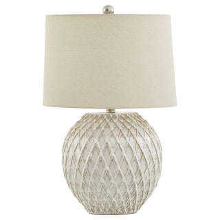 Plain front-on view of the white ceramic table lamp with lattice base and neutral fabric shade.