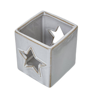 White ceramic tealight holder viewed from above, showing the interior and the glazed brown edges.