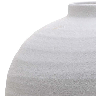 Rough, textured surface detail of the white ceramic vase, showing the transition to the neck.