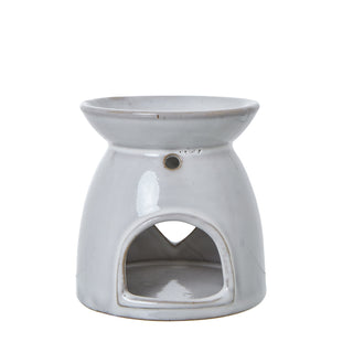 White ceramic wax melt burner showing the glossy glaze and unglazed rim detail.