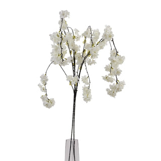 Full view of the artificial white cherry blossom stem with cascading clusters of white flowers, standing in a clear vase base.