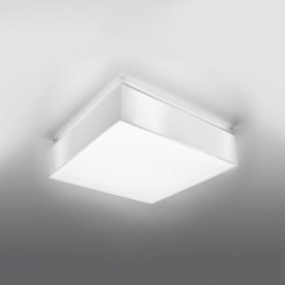 Square ceiling lamp illuminated, showing the depth of the white fitting against the ceiling.