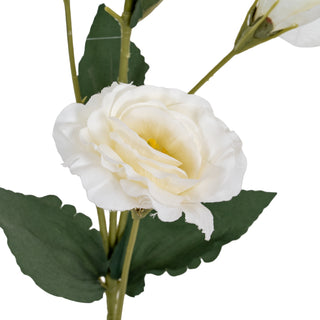 Detail shot of the artificial white lisianthus bloom, highlighting the layered petals and green foliage.