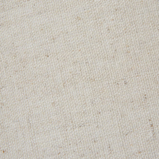 Close-up detail of the cream linen shade fabric, showing the coarse, natural weave texture.