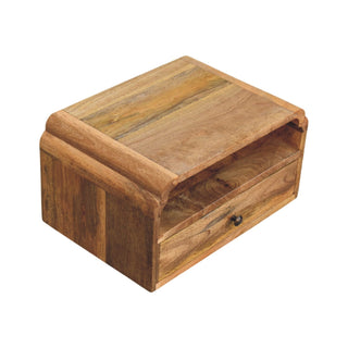 Overhead view of the wooden bedside unit, highlighting the top surface, open storage shelf, and single drawer.