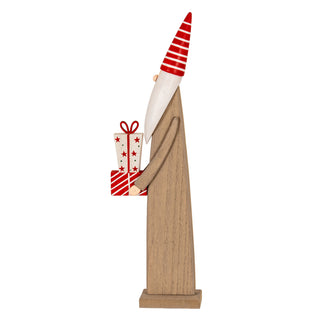 Profile view of the wooden elf, showing the red striped hat and the star-patterned upper present.