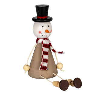 Wooden sitting snowman decoration, full view. It features a conical brown body, top hat, and knitted red and white scarf.
