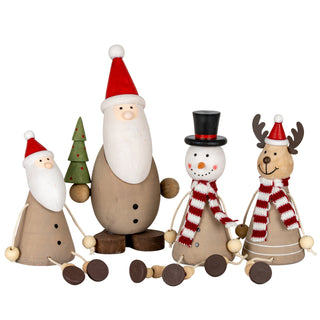 The wooden snowman decoration displayed with matching Santa, reindeer, and Christmas tree figures.