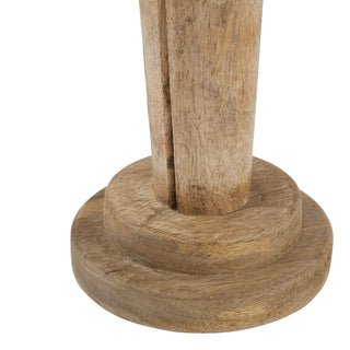 Detail shot of the wooden nutcracker's stepped base and lower body, highlighting the rustic wood grain.