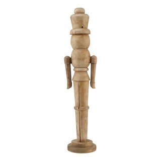 Front view of the turned wooden nutcracker figure, showing its natural grain and rustic finish.