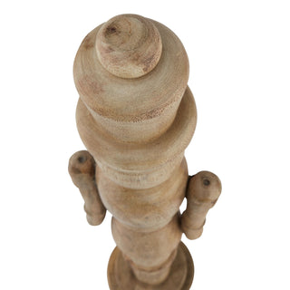 Top-down view of the wooden nutcracker ornament, showing the stacked turned wood sections and arms.