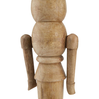 Close-up of the wooden nutcracker's turned torso and hanging arms, showing the natural wood grain texture.