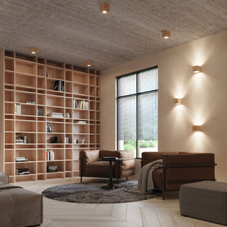 Cuboid wooden lights mounted on the ceiling and wall, creating distinct downward and bi-directional light beams.