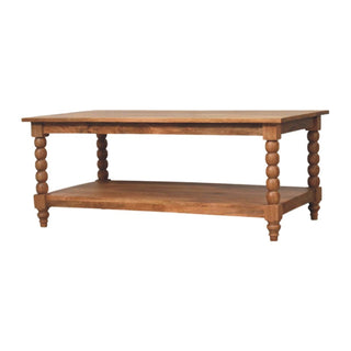 Wooden coffee table with spindle turned legs and a lower storage shelf.