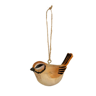 Painted wooden bird decoration, tawny brown and beige, hanging from a natural twine loop against a white background.