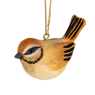 Side view of the wooden bird decoration, highlighting the painted black eye and facial markings.
