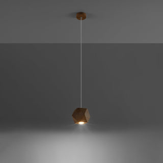 Geometric wood pendant light switched on, casting a warm beam against a dark grey background.