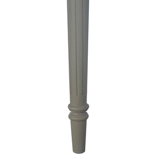 Close-up of the taupe painted desk leg showing the fluted detail and turned foot.